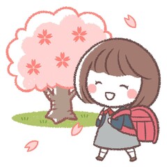 ランドセルを背負う女の子とサクラの木