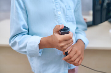 Pediatric patient undergoing a hearing screening procedure