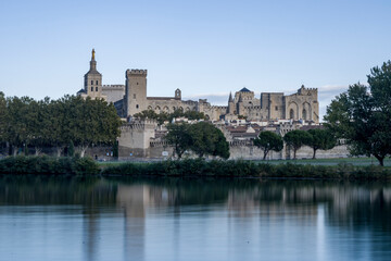 Fototapeta na wymiar Palais des Papes in Avignon with the Rhone River in the foreground