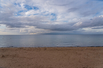 Langrune-Sur-Mer, France - 08 05 2021:  View of the sea from the beach at sunset