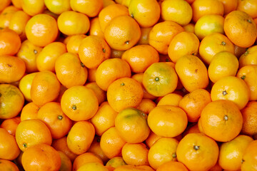 yellow tangerines in the market 