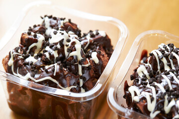 Chocolate cake in packaging container