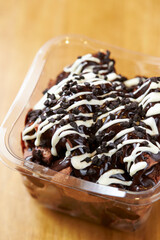 Chocolate cake in packaging container