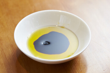 Olive oil in balsamic vinegar on a plate