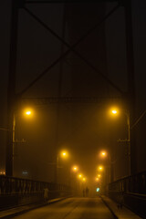 Fototapeta na wymiar Walking in the fog. mystery and rain in porto.