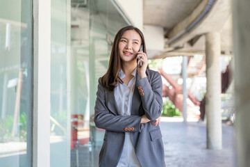 Working woman concept a working woman with smiley face speaking on the phone with her business partner