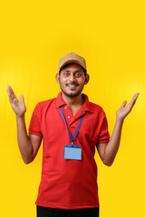 Happy indian man in t-shirt and showing expression isolated over yellow background.