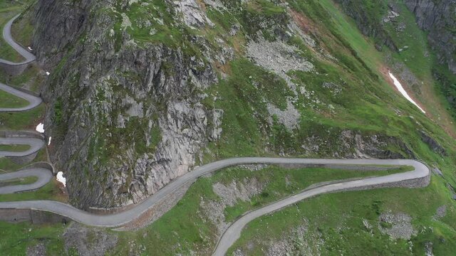 Extreme hight mountain road in swiss alps from aerial view in 4k