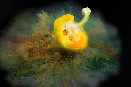 The sliced bell pepper fell, the colored powder exploded.