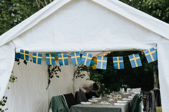 Gazebo decorated with Swedish flags