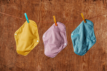 cloth menstrual pads hanging on a clothes line - obrazy, fototapety, plakaty