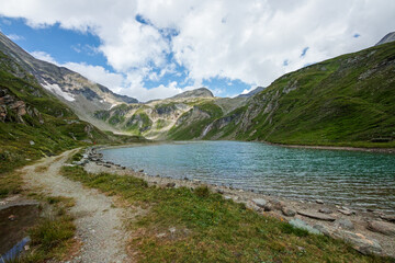 Fototapeta na wymiar Nassfeld Speicher lake next to Grossglockner High Alpine road in Hohe