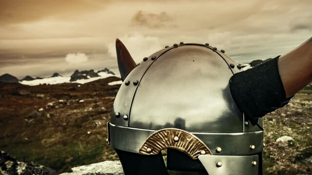 Viking helmet on nature in Norway. Clouds moving over mountains landscape. Time lapse