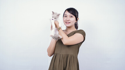 asian woman holding cat laughing isolated white background