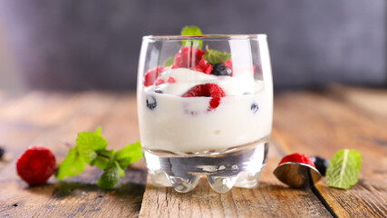 glass with yogurt and berries fruits