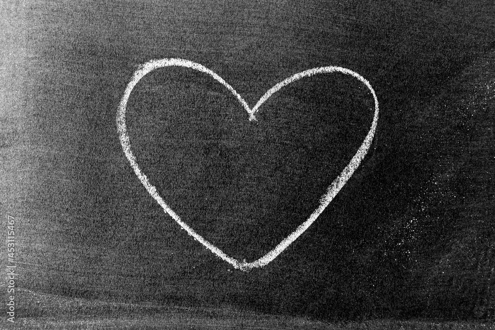 Poster White color chalk hand drawing in heart shape on blackboard or chalkboard background