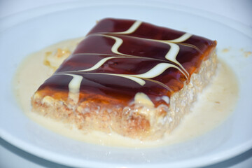 close up of caramel trilece dessert served on plate