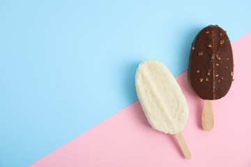Glazed ice cream bars on color background, flat lay. Space for text