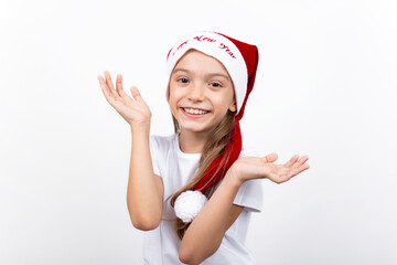 Little caucasian girl in santa hat on white background. Happy smiling kid. christmas design empty copy space.Child's portrait.