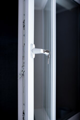 White UPVC window with lockable handle