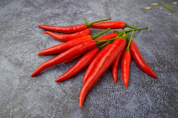 fresh chili peppers on black background,ripe red chili peppers