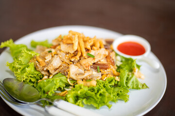 fried noodles on vegetables with chili sauce 
