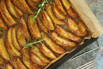A tray with potatoes backed in oven	