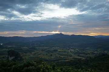 Fototapeta premium Natural landscape of green mountain range with cloudy blue sky