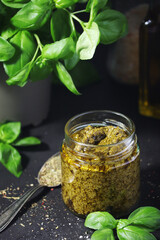 Homemade pesto in a glass jar	