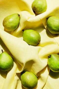 Overhead View Of Pears On Yellow Table Cloth