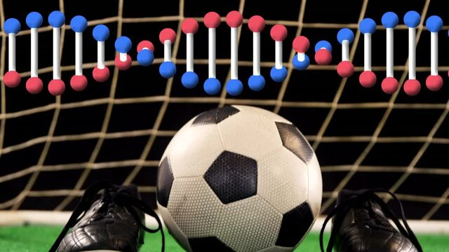 Animation of dna strand spinning over soccer ball and shoes
