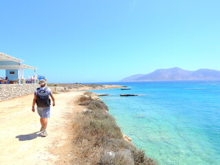 person walking on the beach Cyclades Koufonisia August 2021 Aegean Mediterranean