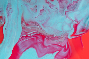Abstract marble background pink and blue colors.Fluid art technique.Liquid texture of nail polish.Macro photography with copy space.