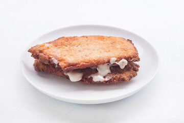 tenderloin booklets stuffed with ham and cheese (libritos spanish food)