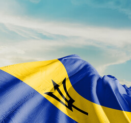 Barbados national flag waving in beautiful clouds.