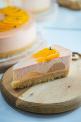 A piece of the peach cheesecake decorated with peaches