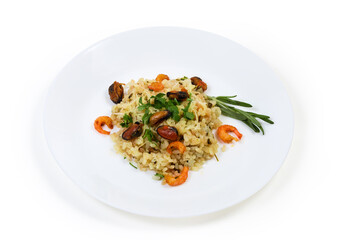 Serving of risotto with seafood on dish on white background
