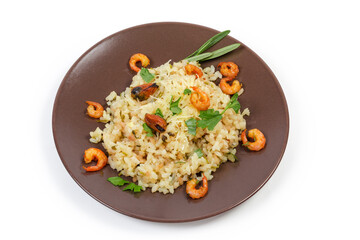 Risotto with seafood on brown dish on a white background