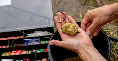 fishing tackle on a wooden float with mountain background and selective focus