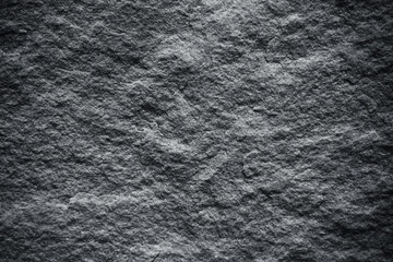 Dark grey rock texture with natural patterns for background