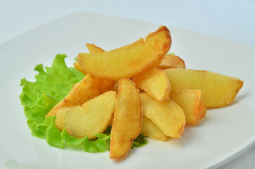 fried potato beer snack on white plate isolated on white