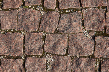 Background from pavement made of stone blocks.