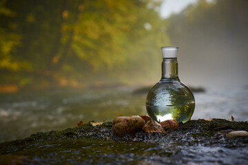 Flask with clear river water.