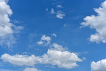 Naklejka na ściany i meble Beautiful cumulus clouds against the blue daytime sky.