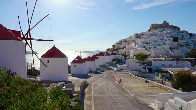 Picturesque Greek town of Chora with windmills and whitewashed buildings with blue doors and balconies on the island of Astypalea, Greece