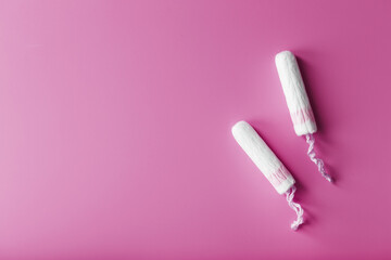 Gynecological tampons on a pink background free space