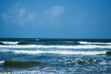 Fototapeta na wymiar Ocean-Sea Waves, Mountains Rock Stones and Sky Blue Landscape Background