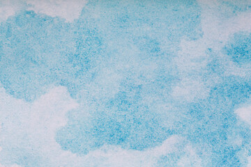 Watercolor background. Blue brush strokes of watercolor paint on white paper.