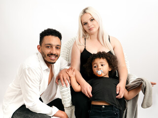 Stylish and happy multi-ethnic family expecting a baby