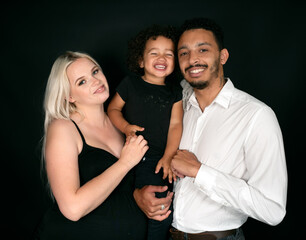 Stylish and happy multi-ethnic family expecting a baby